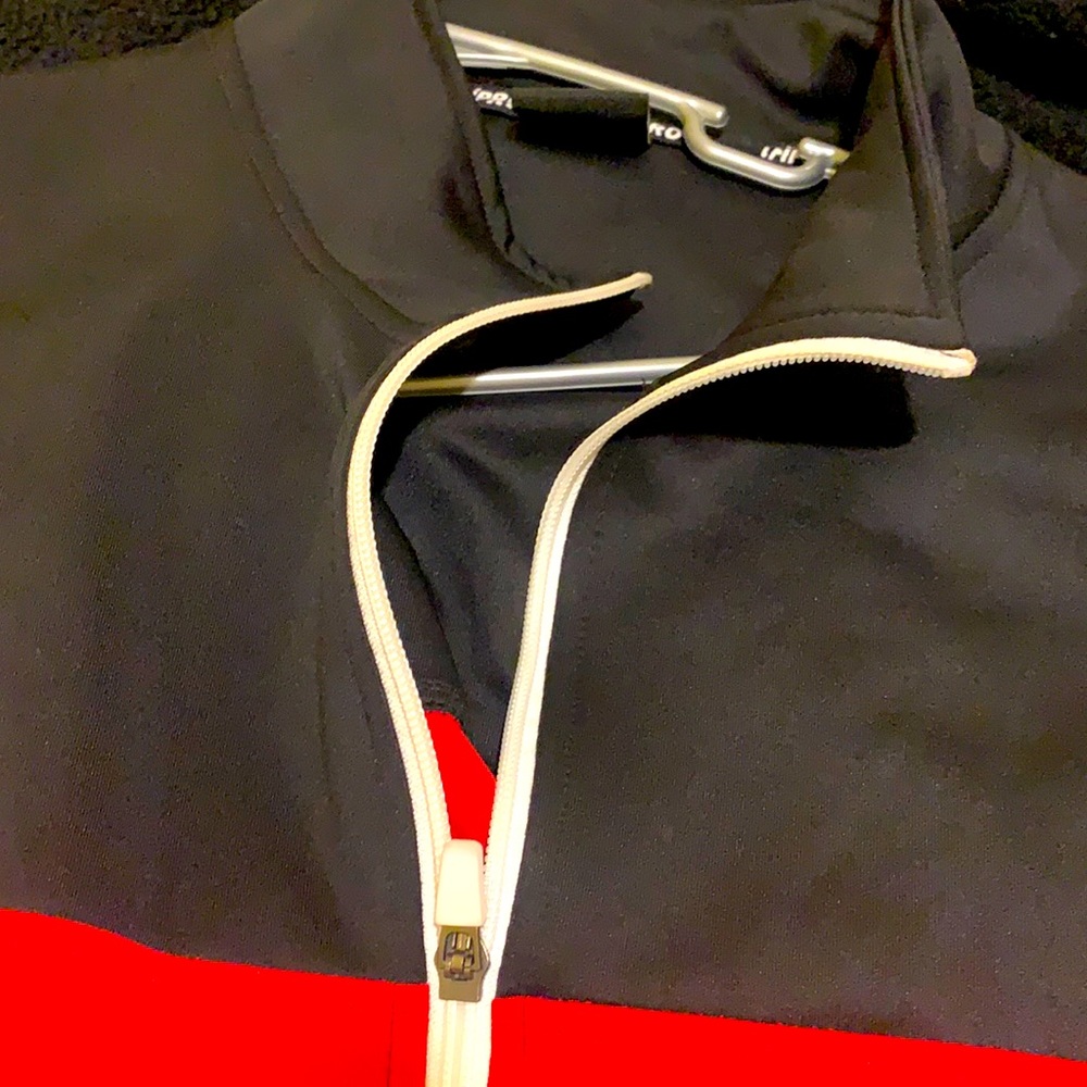 Red and black and white zip up sweater size L
